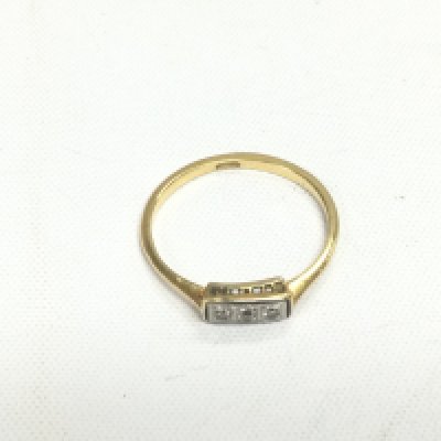 A gold ring set with three small diamonds, approx 2.3g and approx size T. Shipping category A.