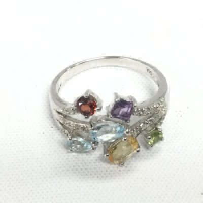 A 9ct white gold ring set with various coloured gemstones, approx 4.4g and approx size R. Shipping category A.