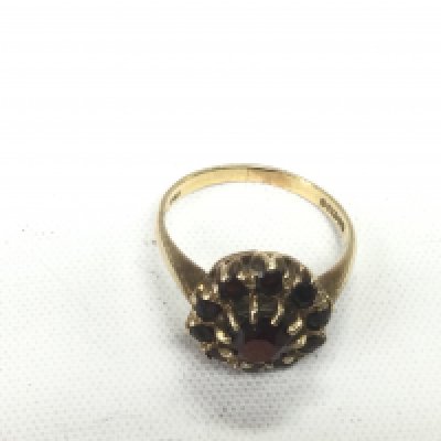 A 9ct gold ring set with rubies, approx 3.1g and approx size L. Shipping category A.