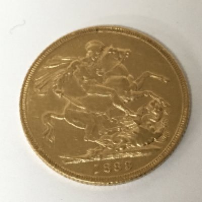 A Victorian gold sovereign dated 1883 with the young queens head side profile.