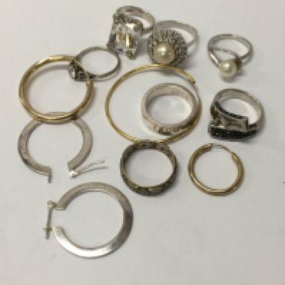 A collection of rings including silver together with loose earrings.