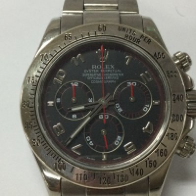 Rolex Daytona 18ct white gold case and strap. 40mm case. Racing dial with red sub dial hands . F serial number which is circa 2004. Watch running. No box or papers.