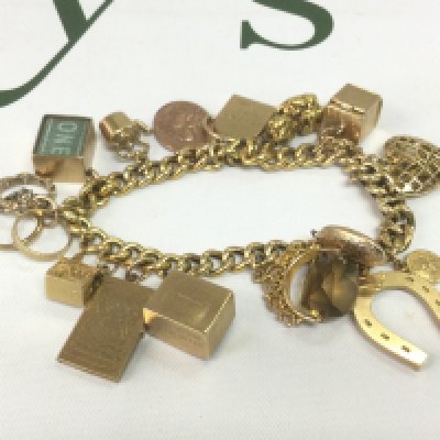 A heavy gold charm bracelet, approx 53.5g  Shipping category A.