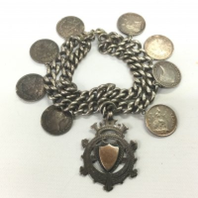 A silver charm bracelet. Shipping category A.