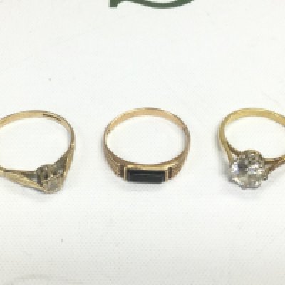 Three gold rings set with stones, approx total weight 5.4g. Shipping category A.