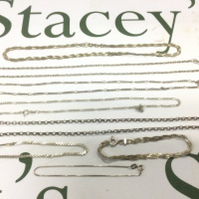 A collection of silver chains. Shipping category A.