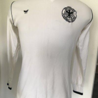 1979 Germany Match Worn Football Shirt: White long sleeve Erima shirt with number 5 to rear. Worn in the match v Republic of Ireland on 22 5 1979. Swapped with Eire player Mick Martin, who is prepared to offer a COA. Mick can not remember name of opposing player.
