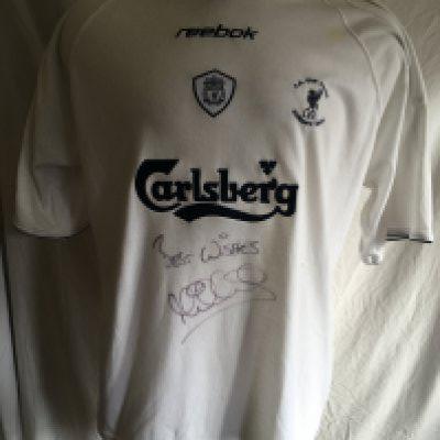 2001 Liverpool FA Cup Final Warm Up Football Shirt: This was supplied to Michael Owen who has signed the shirt. This white short sleeve shirt was used for the warm up. Michael of course scored two late goals to win it. No name number or AXA arm patches applied.