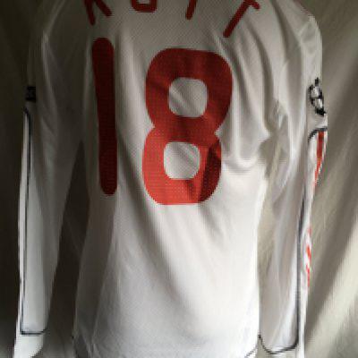 Kuyt Liverpool 2009 - 2010 Champions League Match Issued Football Shirt: Long sleeve white shirt with Champions League badging with number 5 to demonstrate trophy wins to arms and Carlsberg sponsor. Issued to Kuyt whose name and number 18 appear to rear. Signed by Kuyt to front.