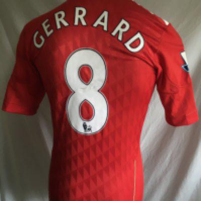 Gerrard 2010 - 2012 Liverpool Match Worn Football Shirt: Red number 8 with Gerrard to rear. Premier League badging to arms. Signed to front by Gerrard.