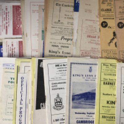 Kings Lynn Football Programmes: Over 50 mainly away programmes from the 60s and 70s with a few earlier. Quantity of team sheets then four very heavy boxes of modern home and away programmes. (5 boxes)