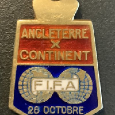 1938 England v Rest Of Europe Football Medal: Players participation medal for the match at Arsenal on 25 10 1938. To celebrate 75 years of the Football League. Has 3 Lions to rear with enamel front stating Angleterre v Continent with FIFA and date. Small medal with ring suspension does not have a hallmark.