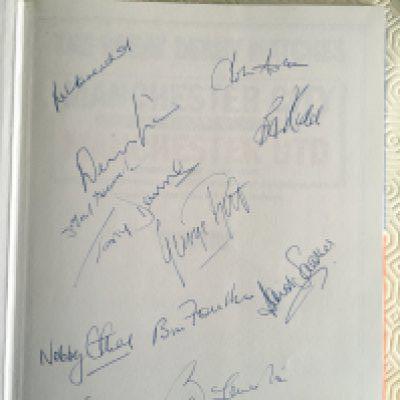 1968 Manchester United Complete Squad Signed Football Book: All 1968 European Cup winners have signed the inside blank page of the Great Derby Matches book. Hand signed in biro to include Charlton, Best and Law. Nice item.