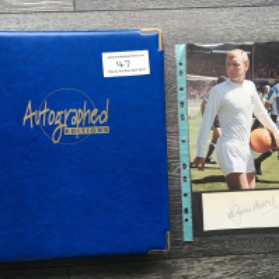 1966 England World Cup Winners Signed Football Prints: All ten of the official Autographed Editions prints of the 1966 England team. C/W a large signed white card of Bobby Moore and picture of him in England kit. No Autographed Edition was ever made of Moore as he died in 1993 before they were produced. Stunning items in official folder. (11)