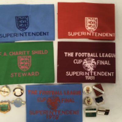 Wembley Steward Football Badges: Cloth arm badges two just stating Superintendent and other Superintendent for the 1979 + 1981 League Cup final plus a late 70s Charity Shield. Also there are 8 metal pin badges covering periods from 1964 to 1980 plus two WC Willie badges. (12)