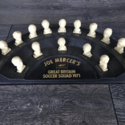 Football Memorabilia Box: Includes complete set of Joe Mercers Cleveland Busts with stand, 1968 club colours poster supplement with Jag, Books, Esso 1970s coin set and badge set plus an Everton rosette.
