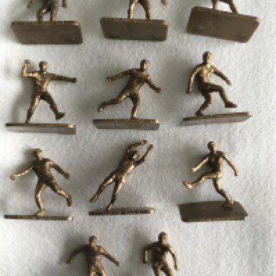 Total Petrol Set Of Football Figures: Big League Stars Of The 70s Complete set of 11 gold 2 inch high plastic figures on stands. Each player named and include Best Ball Hurst Hollins Banks Hughes Bremner Cooper Astle Dougan and Mullery. (11)