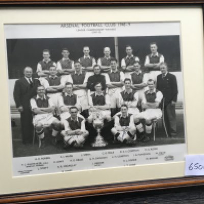 Arsenal 1948 League champions Fully Signed Photo: Original framed photo by Jaques fully signed by all 18 players plus manager and trainer pictured. Hand signed in pen with some not distinct where a dark pen has been used on a dark background. Taken at the beginning of the 48/49 season with league championship trophy to front.