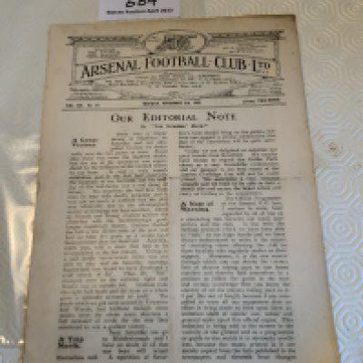 Arsenal Football Memorabilia Box: 11 handbooks with 6 from the 50s and 5 from the 60s. Quantity of overall fair condition 50s and 60s home programmes. Nice scrapbook from 68/69 which has a few programmes and tickets stuck in along with cuttings and privately taken photos.
