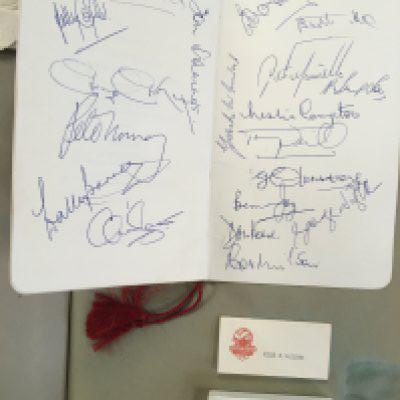 Arsenal Scrapbook + Autograph Book: Excellent w rap book from 69/70 and 70/71 with a stuck down supporters club menu for the 1969 player of the year signed by the whole team plus some old players. C/W a nice autograph book with detached cover with opposite pages having been signed by Logie Holton Mercer Compton Bowen Lishman and 6 others.