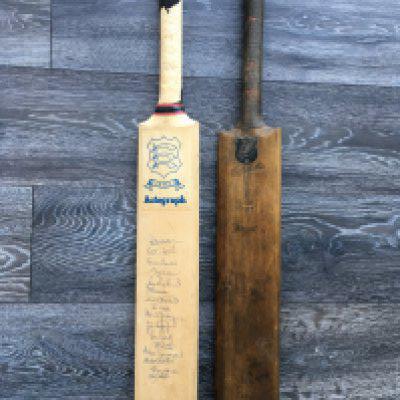 1980s Signed Essex Cricket Bat + 19th Century Bat: Full size Essex bat with 16 clear autographs including Graham Gooch Paul Pritchard Keith Fletcher and Brian Hardie. C/W an original bat from 1879 with plaque stating W Ash for bowling 4 wickets with 4 consecutive balls. Bats are good but obviously rubber around handles has perished. (2)