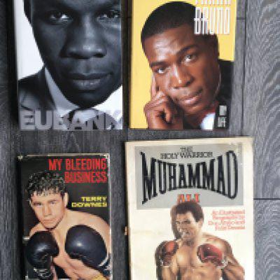 Boxing Memorabilia Box: Signed undedicated hardback books by Eubank Bruno a dedicated autograph by Downes and a signed fdc by Henry Cooper. Was of programmes to include a few Bruno plus Magri Kaylor some magazines and more.