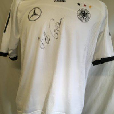Hamann Germany Signed 2002 Football Shirt: Given to vendor directly by his friend Hamann. Could be a training top as has Mercedes logo to one breast and the usual Adidas logo has moved to the middle with German badge and 3 coloured stars to other breast. Signed clearly without dedication to front by the last goalscorer at Wembley. Inner mesh attached.