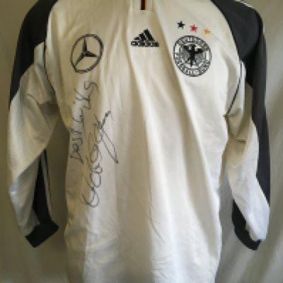Hamann Germany Signed 2000 Football Shirt: Given to vendor directly by his friend Hamann. Could be a training top as has Mercedes logo to one breast and the usual Adidas logo has moved to the middle with German badge and 3 coloured stars to other breast. Signed clearly without dedication to front by the last goalscorer at Wembley. Slight stain.