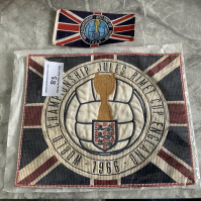 1966 World Cup Top Table Dinner Place Setting: Incredibly rare felt place setting for World Cup dinner with World Cup logo around a Union Jack. C/W small table flag that was on every table at this unique event. (2)