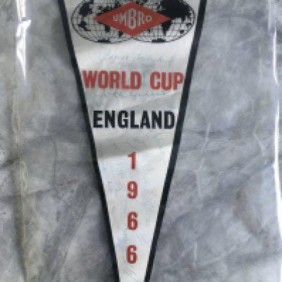 1966 World Cup Signed Germany Squad Pennant: Large Umbro pennant which states World Cup 1966 England as Umbro supplied the kit for the England team. Signed in the day by 18 in blue biro by the German team and Bert Trautmann who travelled with the Germans.