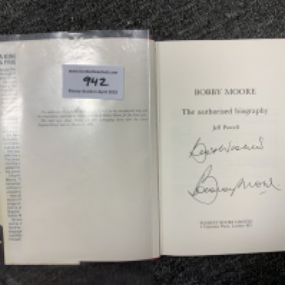 Bobby Moore West Ham + England Signed Football Book: Bobby Moore by Jeff Powell the 1976 hardback featuring Bobby to cover with bow tie. Signed inside clearly in biro Best Wishes and undedicated. Near mint condition.