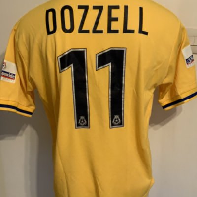 Colchester United 2001 - 2002 Match Worn Football Shirt: Yellow short sleeve with Nationwide badging to arms. Tear on front of collar. Number 11 Dozzell to rear.