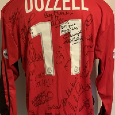 Colchester United 2001 - 2002 Match Worn Football Shirt: Red long sleeve with Nationwide badging to arms. Number 11 Dozzell to rear. This shirt was presented to him by the team when he left and is signed by the squad with messages.