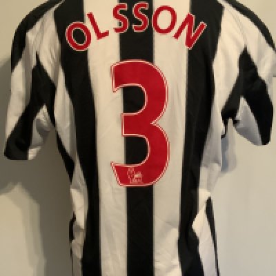 West Brom 2010 - 2011 Match Worn Football Shirt: Worn v Arsenal on 19 3 2011. Home short sleeve with Premiership badging to arms and number 13 Olsson to rear.