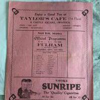 1927 - 1928 Swansea Town v Fulham Football Programme: Very good condition with no team changes. Very large 4 page pink programme which has a fold and will be sent folded.