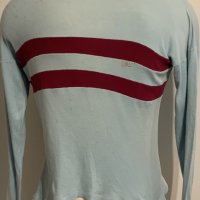 1970 West Ham Original Football Shirt: Iconic blue with the two claret hoops. Label fading but can make out the word sportswear and we imagine this is a size large with long sleeves. Good condition with small mark between hoops to rear. Tiny tear to shoulder.