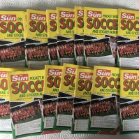 The Sun Shop Display Football Card Sets: Pocket Book Of Soccer small empty albums x 18. C/W box featuring Lineker in England kit containing 15 x set 1, 15 x set 2, 14 set 3 and 15 set 4. You need a set of 4 to complete a book which contain 10 cards in each set. Display box has tears and you could make 14 complete sets of 40 with accompanying albums. Rare chance.