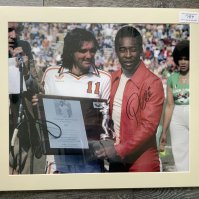 Pele + George Best Signed Football Print: In mount measuring 27 x 23 inches with COA from leading dealer A1 Sporting Memorabilia. Depicts the scene of Pele receiving the award of the greatest Soccer player in the world from Best. Only Pele has signed.
