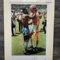 Pele + Bobby Moore Signed Football Print: In mount measuring 19 x 26 inches with COA from leading dealer A1 Sporting Memorabilia. Depicts Pele after swapping shirts at the 1970 World Cup with Moore. Signed by Pele only.