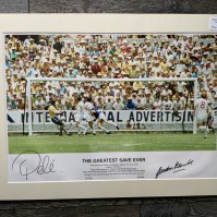 Pele + Banks Signed Football Print: In mount measuring 27 x 20 inches with COA from leading dealer A1 Sporting Memorabilia. Depicts the scene of Pele heading towards goal and Banks about to save at the 1970 World Cup. Print is named The Greatest Ever Save.