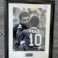 Pele + Muhammad Ali Signed Framed Football Photo: Black and white photo with matching frame and mount measuring 22 x 17 inches. Plaque states Sporting Greats and comes with COA from Sporting Moments. Signed by Pele only.