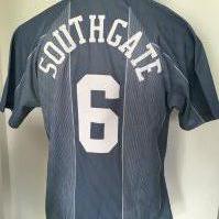 Gareth Southgate Original England 1996 Signed Shirt: Grey number 6 with Southgate to rear the same as the one he famously missed a penalty in during Euro 96. Number 6 to front signed lightly to front and dedicated to George. Whilst not considered a match shirt it was certainly made in 1996 by Umbro.