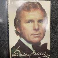 Bobby Moore West Ham + England Signed Football Book: Bobby Moore by Jeff Powell the 1976 hardback featuring Bobby to cover with bow tie. Signed inside clearly in biro Best Wishes and undedicated. Near mint condition.