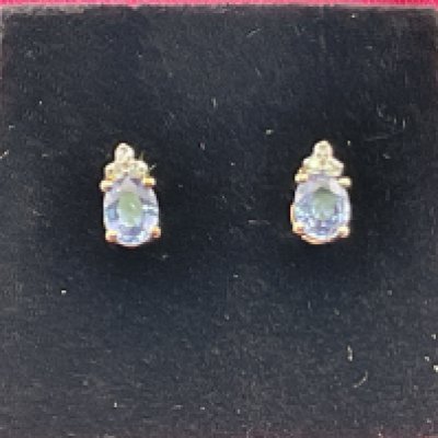 A pair of 9ct gold diamond and tanzanite earrings. Postage category A.