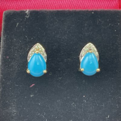 A pair of 9ct gold earrings set with diamonds and turquoise. Postage category A.