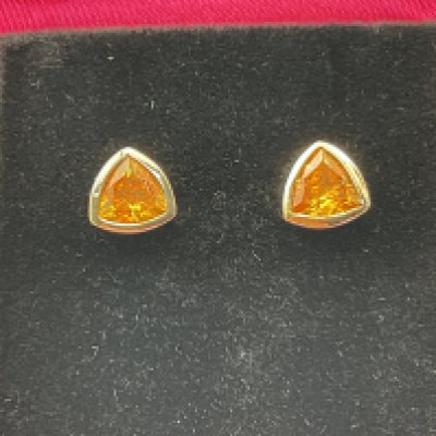 A pair of 9ct gold earrings set with citrine. Postage category A.