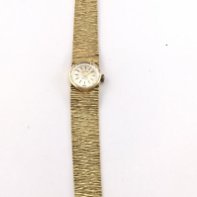 An 18ct gold ladies watch not seen running. 42.05g