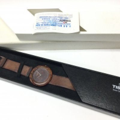 A boxed Tissot Wood Watch, brought in 1993. Postage category B