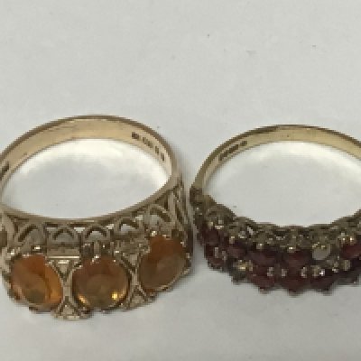 Two 9carat gold rings set with garnets and one other ring set with yellow citrine weight 5.8g