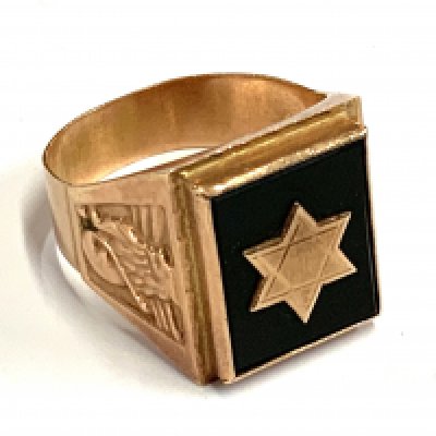 A middle Eastern gold college style ring inset with onyx and a Star of David motif in gold. 7.28g, Size W. (A)